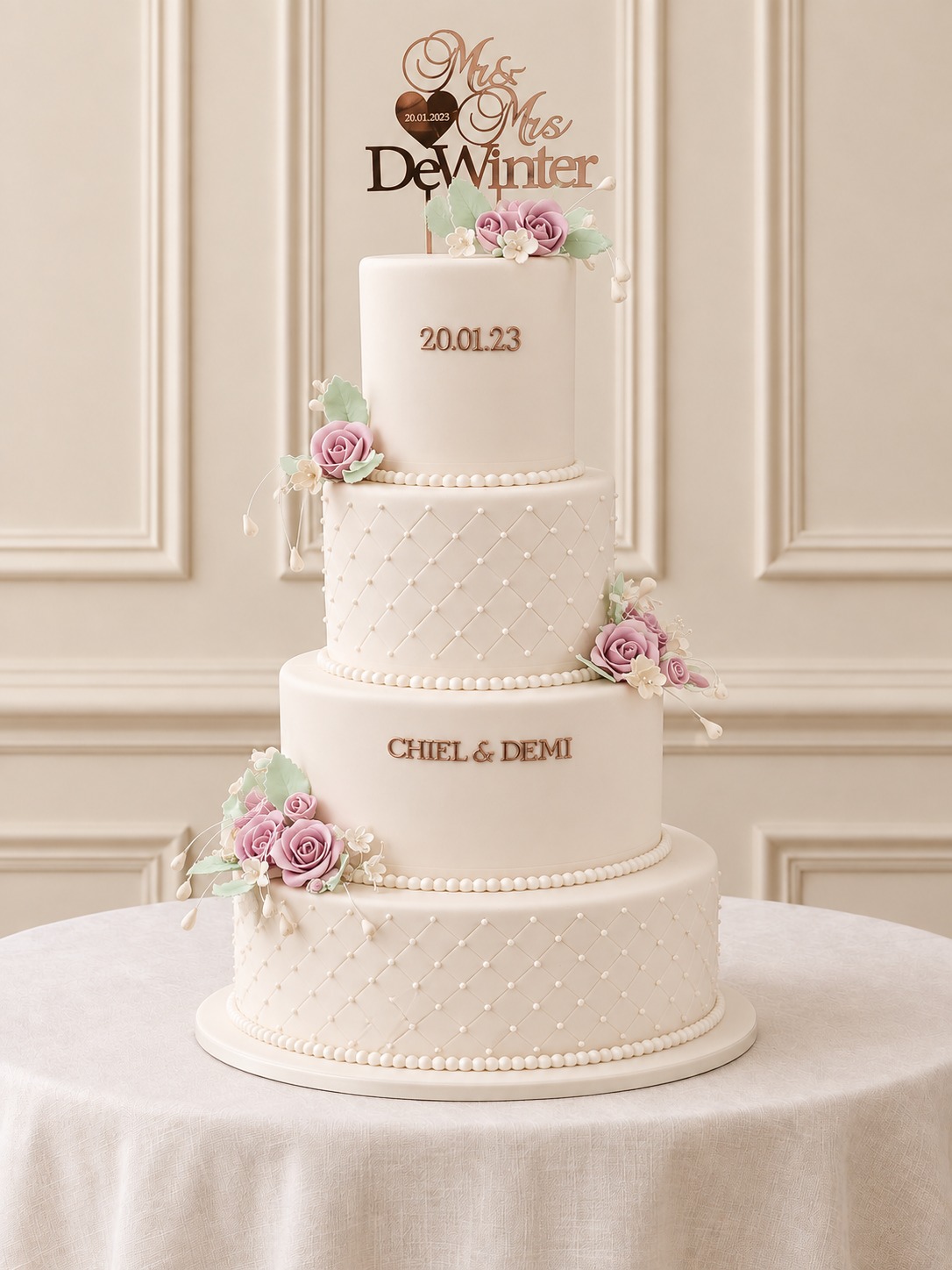A real Nelly's Cakes traditional wedding cake, design Traditional 028, on the atelier's studio backdrop